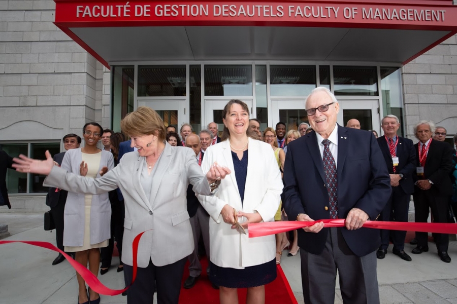 Donors observe Principal and Vice-Chancellor, Suzanne Fortier, Dean Isabelle Bajeux, and Marcel Desautels (C.M., LLD’07) cut the ribbon in front of the new Donald E. Armstrong Building on May 25.
