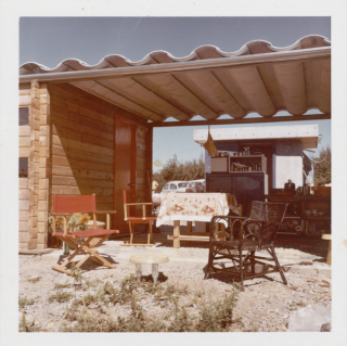 Outside view of the ECOL house showing the kitchen and outdoor seating area