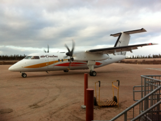 A Cree Air plane on the tarmac.