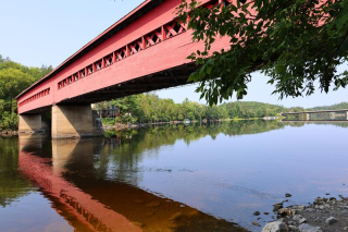 A red bridge over the Gatineau River.