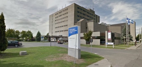 View of hospital and parking lot.