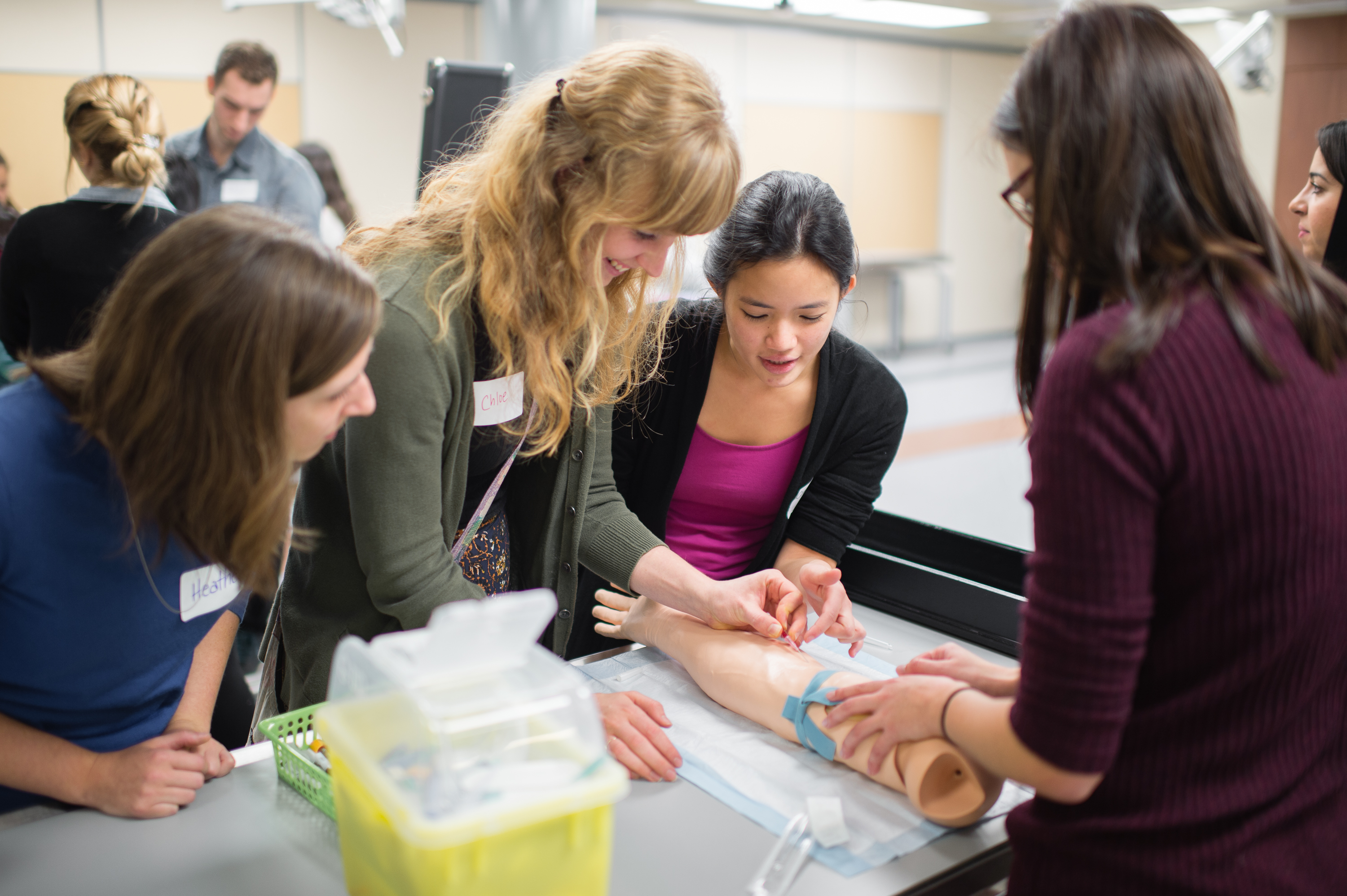 Students examining an artificial limb