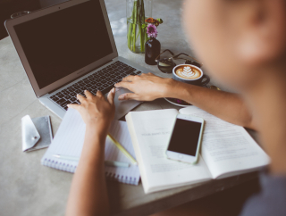 Person typing on laptop