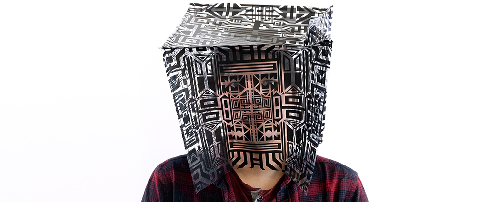 "Alexandre," one of six pieces in the Fragments series by artist Caroline Monnet, features a patterned cube over the face of man.
