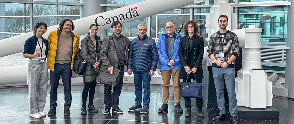 Group poses with Canadarm