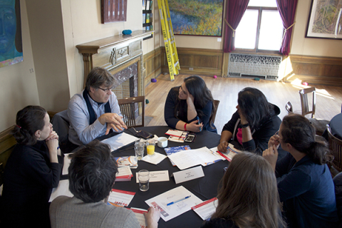 Supervisor advising a group of students