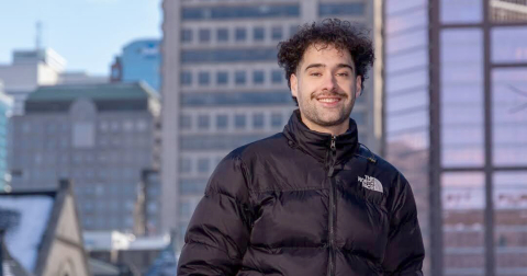 Bryden Bukich pictured with a Montreal cityscape in the background.
