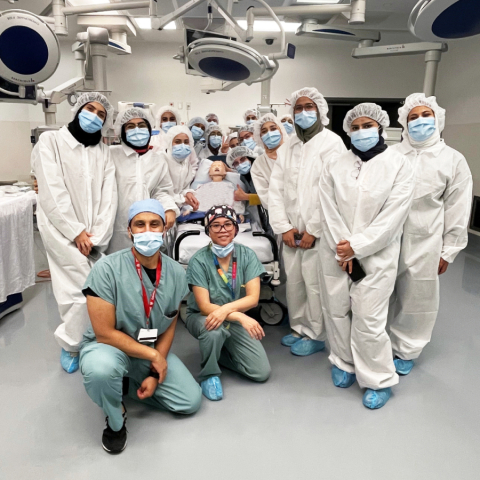 Students in operating room Students wearing blue scrubs in an operating room classroom.
