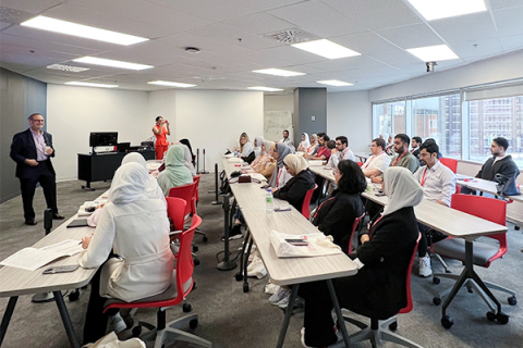 students in classroom with professor