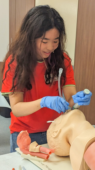 Student intubating a manikin