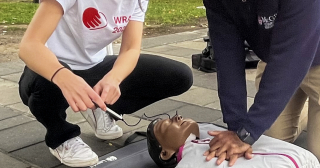 Students perform CPR on a manikin