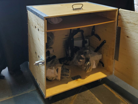 Transportation crate for microscopes sits on floor
