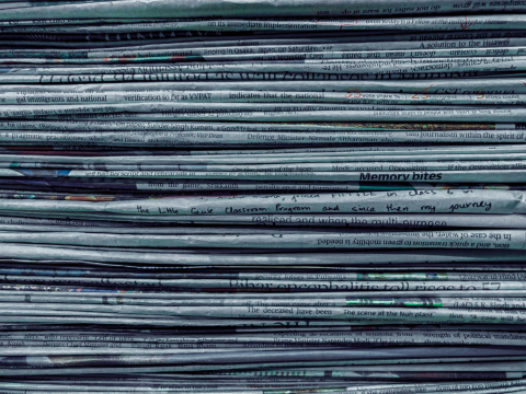 Stack of different newspapers