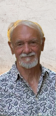 Man in a paisley shirt, smiling