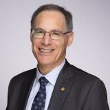 Man in suit smiling