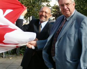 Professors Dahlberg and Etemad raising the McGill flag at the 2005 conference
