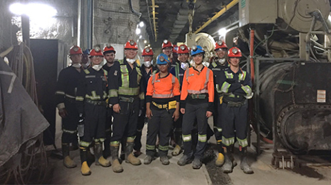 a group of people standing in a tunnel