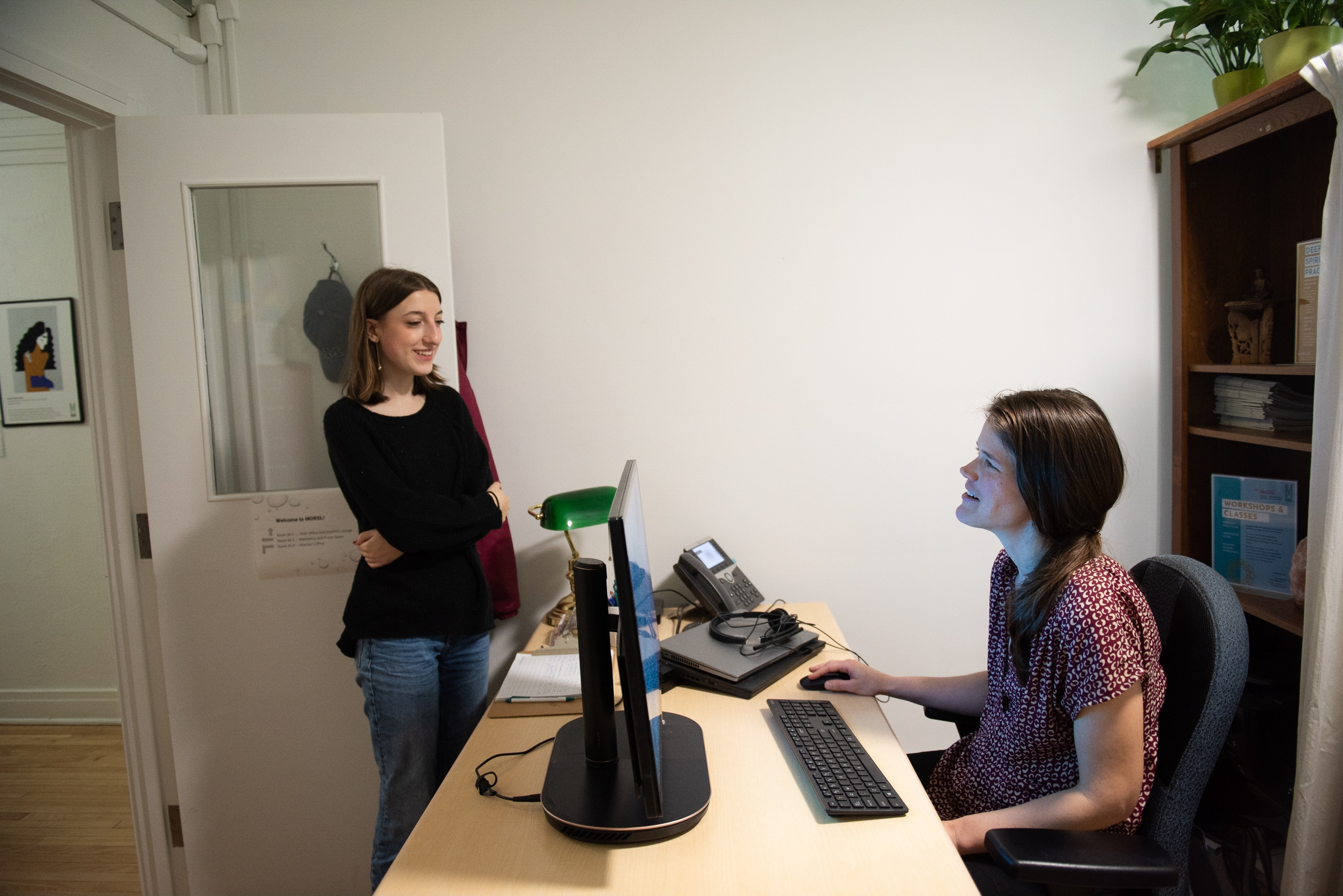 Candice Wendt greeting a student at MORSL office