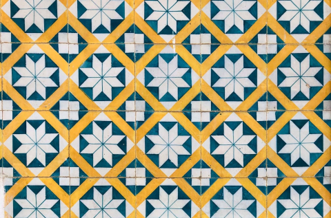 Mosaic tiles, yellow, blue, and white.