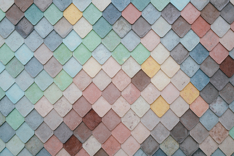 Diamond shaped tiles coloured in shades of blue, green, rose, yellow and red.