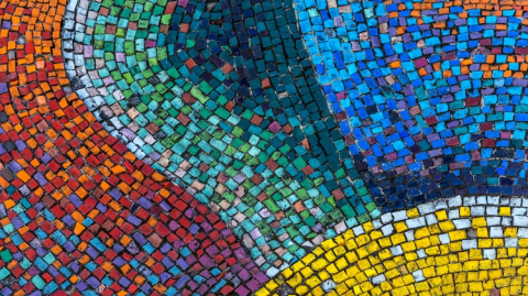 A marble mosaic with waves of different colours