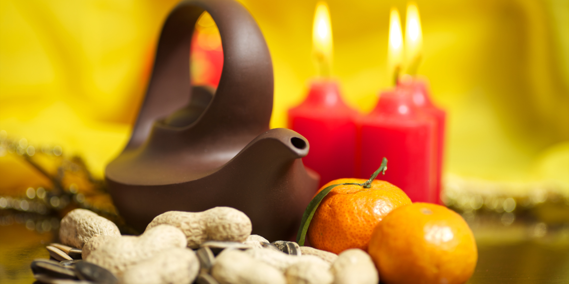 candles, kettle, mandarin oranges and peanuts