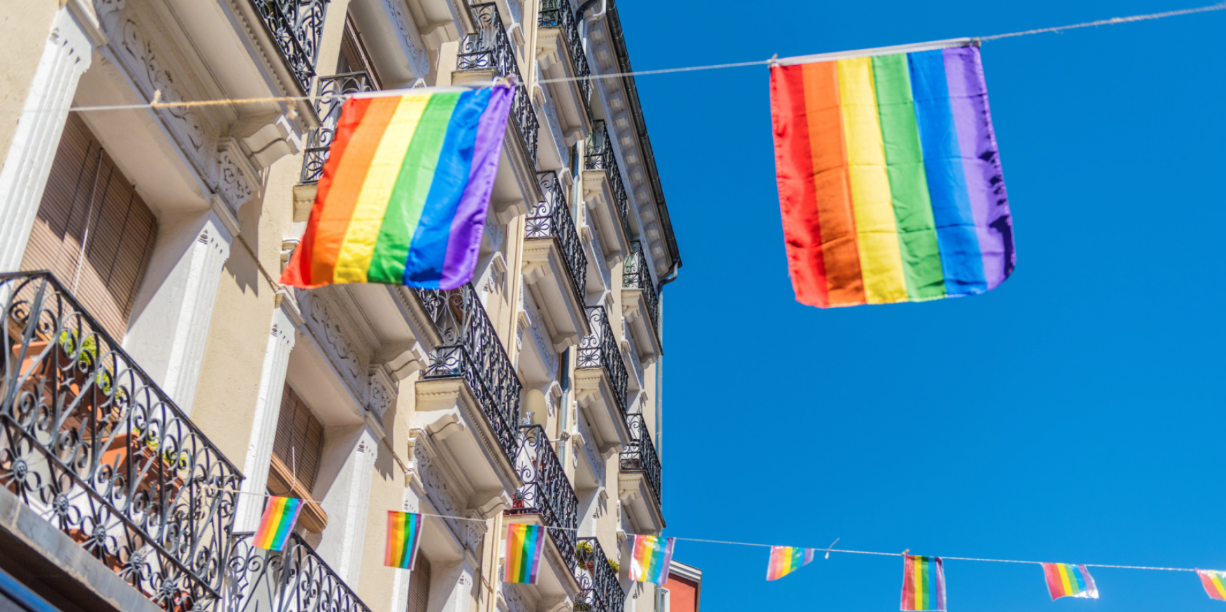 Pride flags hung across a building