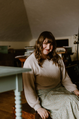Susanne sitting in a chair in a room