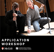 Musician is kneeling while pointing on musical score while a second musician looks on