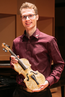 Golden Violin Award winner holds the Golden Violin