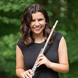 Photo of Emily Brown holding a flute