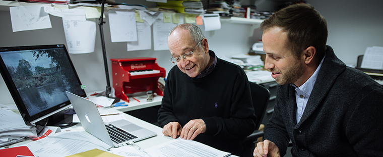 Two men looking over music score