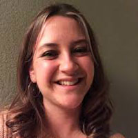 Headshot of a smiling Rebekah Dennis