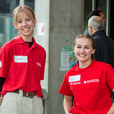 two students smiling at camera