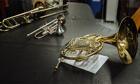 Brass instruments laying on a table