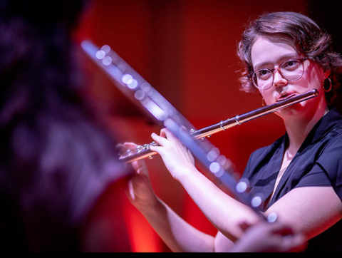 student playing flute