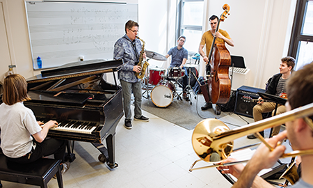 Professor REmi Bolduc plays with jazz combo