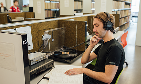 student in library