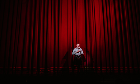 Patrick Hansen in front of curtain