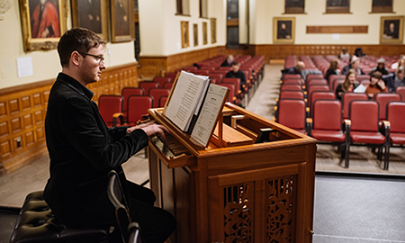 Oranist playing in Redpath Hall