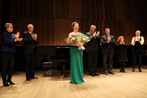 Winner Chelsea Rus on stage at Tanna Schulich Hall with Jury and Elizabeth Wirth.