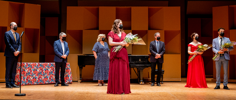 Award recipients on stage after concert ceremony