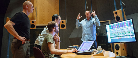 two men standing in sound studio