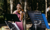 Jade Roth playing violin outside