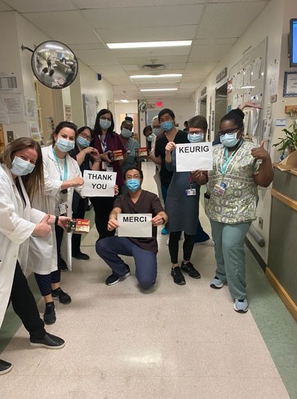 Frontline Neuro Staff posing with signs that say "Thank You"