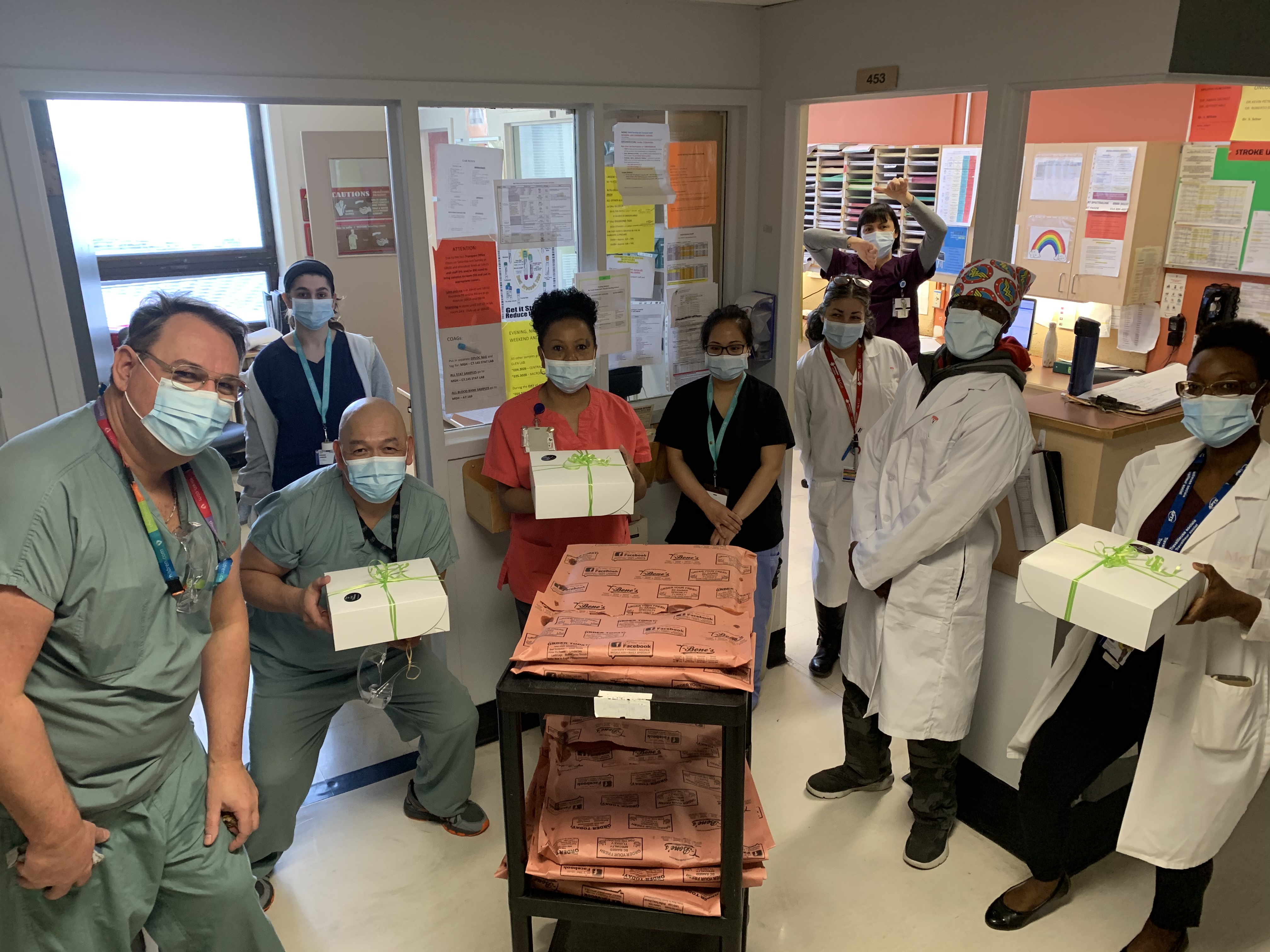 Hospital staff enjoy pizza, cookies and cannolis donated by Mimma Devito of NDG Bakery