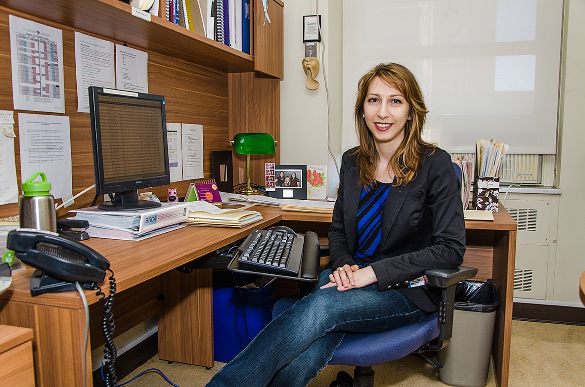 Nancy Anoja sitting at her desk at The Neuro 