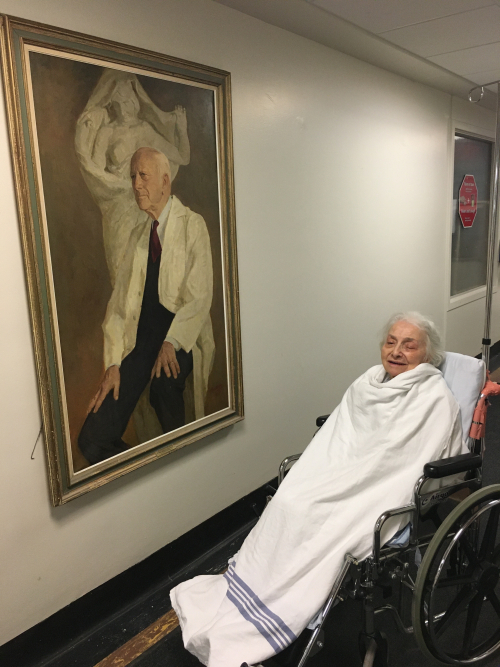 Freda Clavier Edelson by the portrait of Dr. Wilder Penfield at The Neuro.