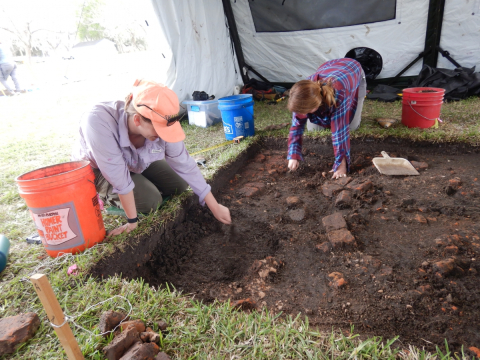 Archaeologists doing fieldwork.