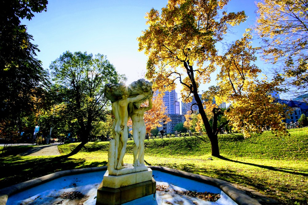 Three bares statue on Fall campus